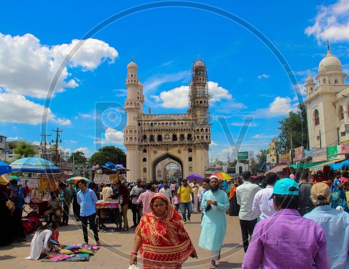 Majestic Charminar View with Tourists And Blue Sky Background