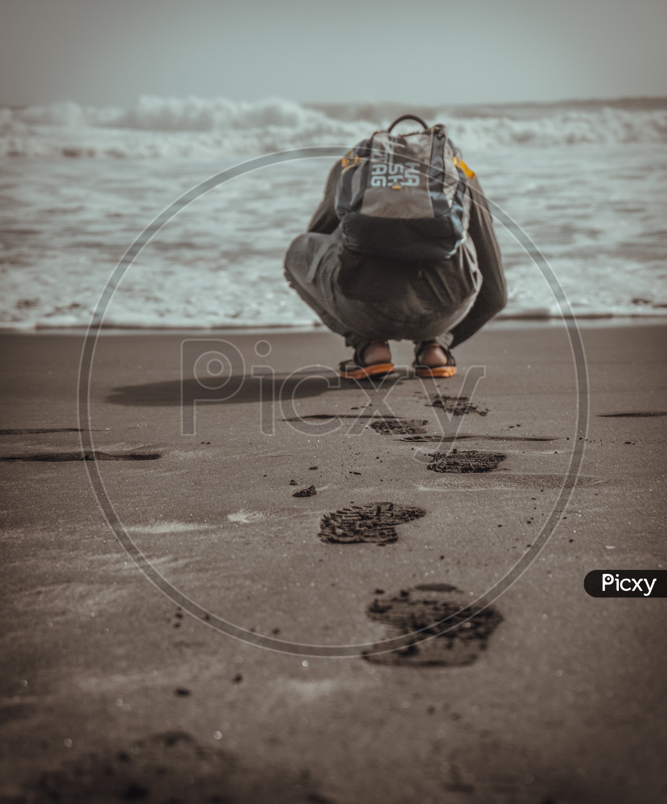 A photographer clicking pictures at the beach