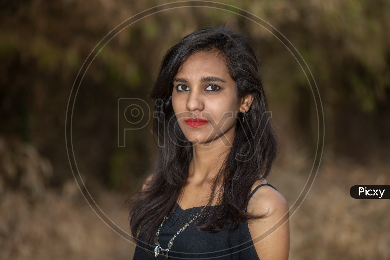 young Indian Girl  Posing  outdoor  with Nature Background