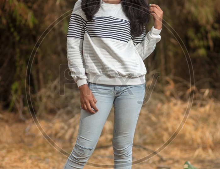 young Indian Girl  Posing  outdoor  with Nature Background