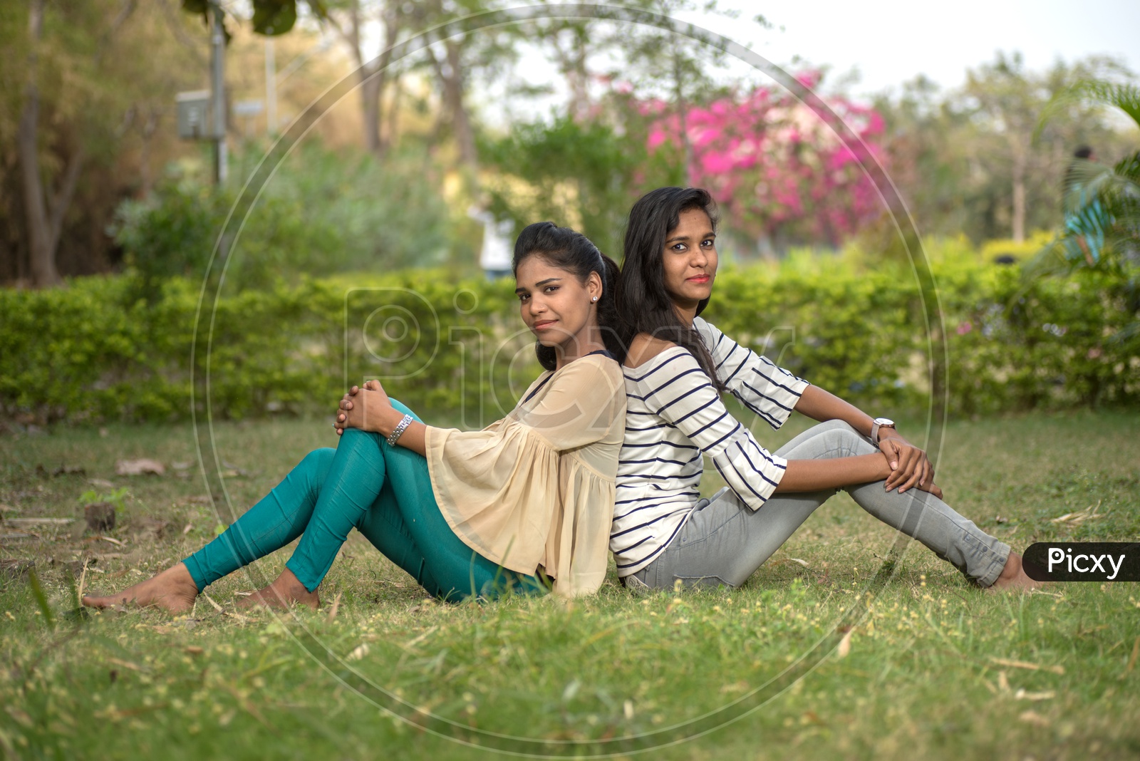 Young Indian Girls Students Friends Posing Outdoor  With Nature Background