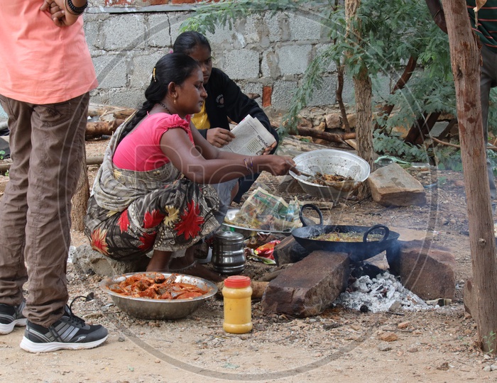 A Woman Vendor Preparing Fish Fry on Road Side