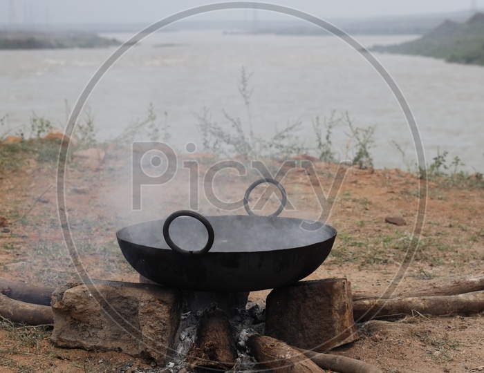 Kadai hot Oil Pan to fry fishes on Traditional Wood Stove