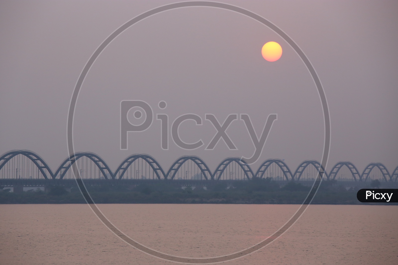 Sunset Over The Railway Arch Bridge  on Godavari River
