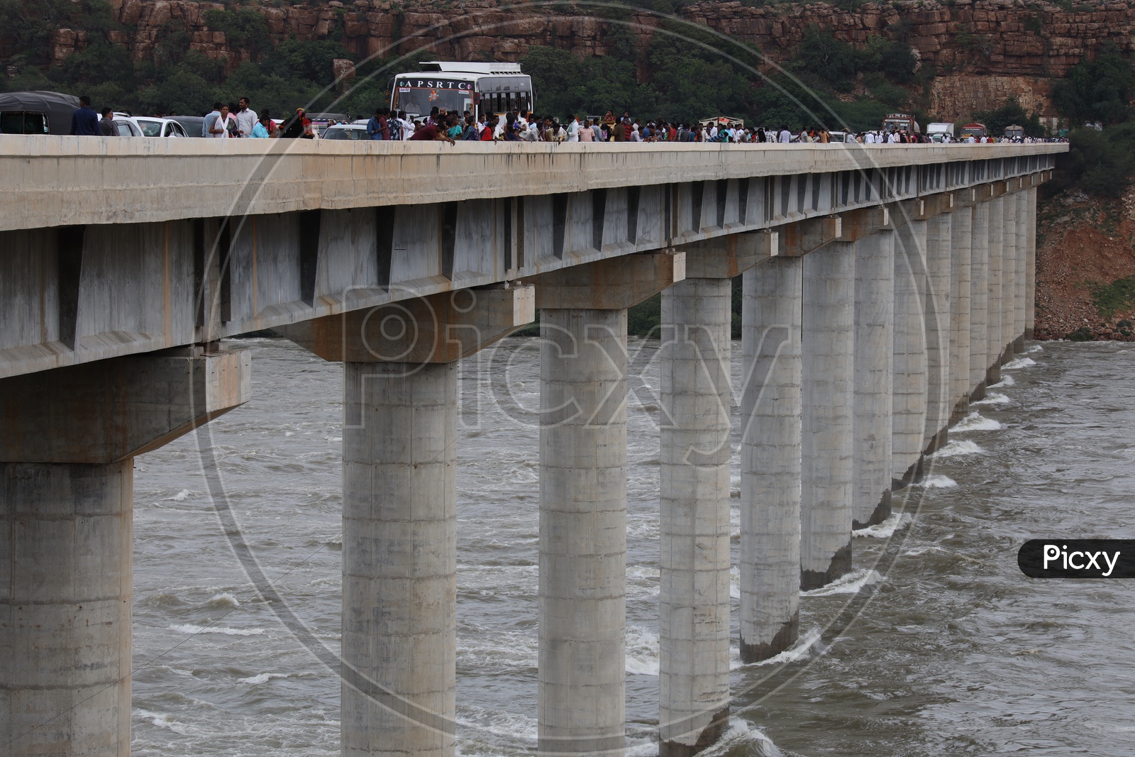 Water Flowing At Full Strength With Currents Due to Heavy Floods To Nagarjuna Sagar Dam  At The Bridge