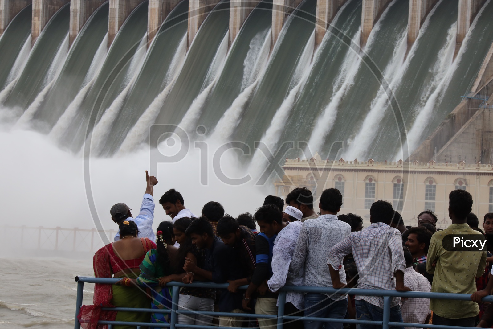 Visitors Watching The  Nagarjuna Sagar Dam Gates Opened Water Gushing Due To Heavy Floods