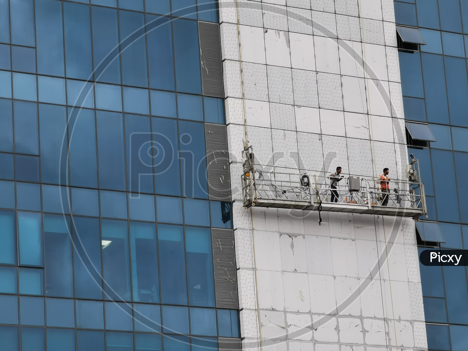 Workers Working  On Corporate Companies Facade