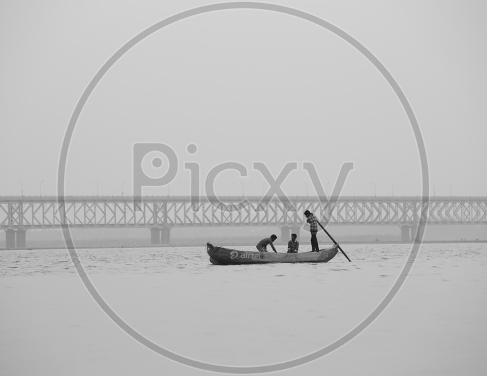 Fisher Boats on River Godavari With  Railway Cum Road Bridge In Background