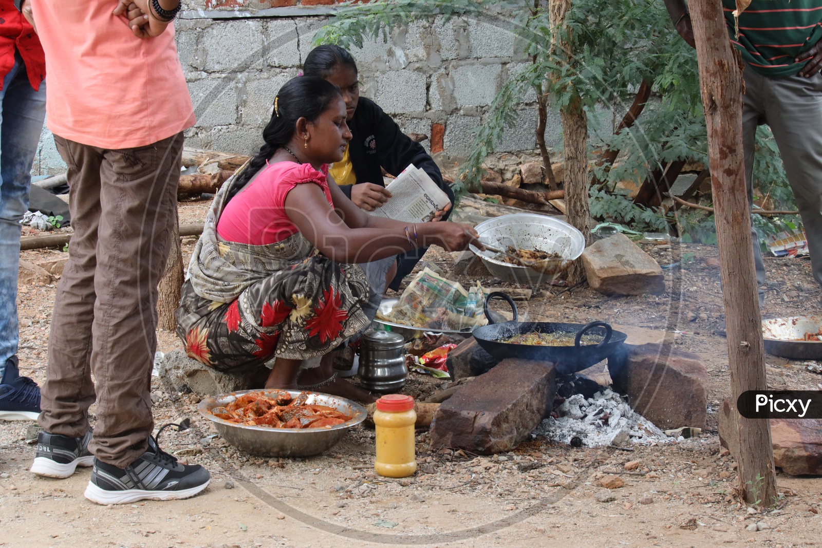 A Woman Vendor Preparing Fish Fry on Road Side