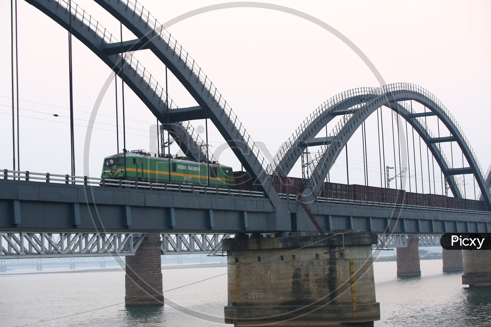 Train on the Arch Bridge  And Fisher boats in River Godavari