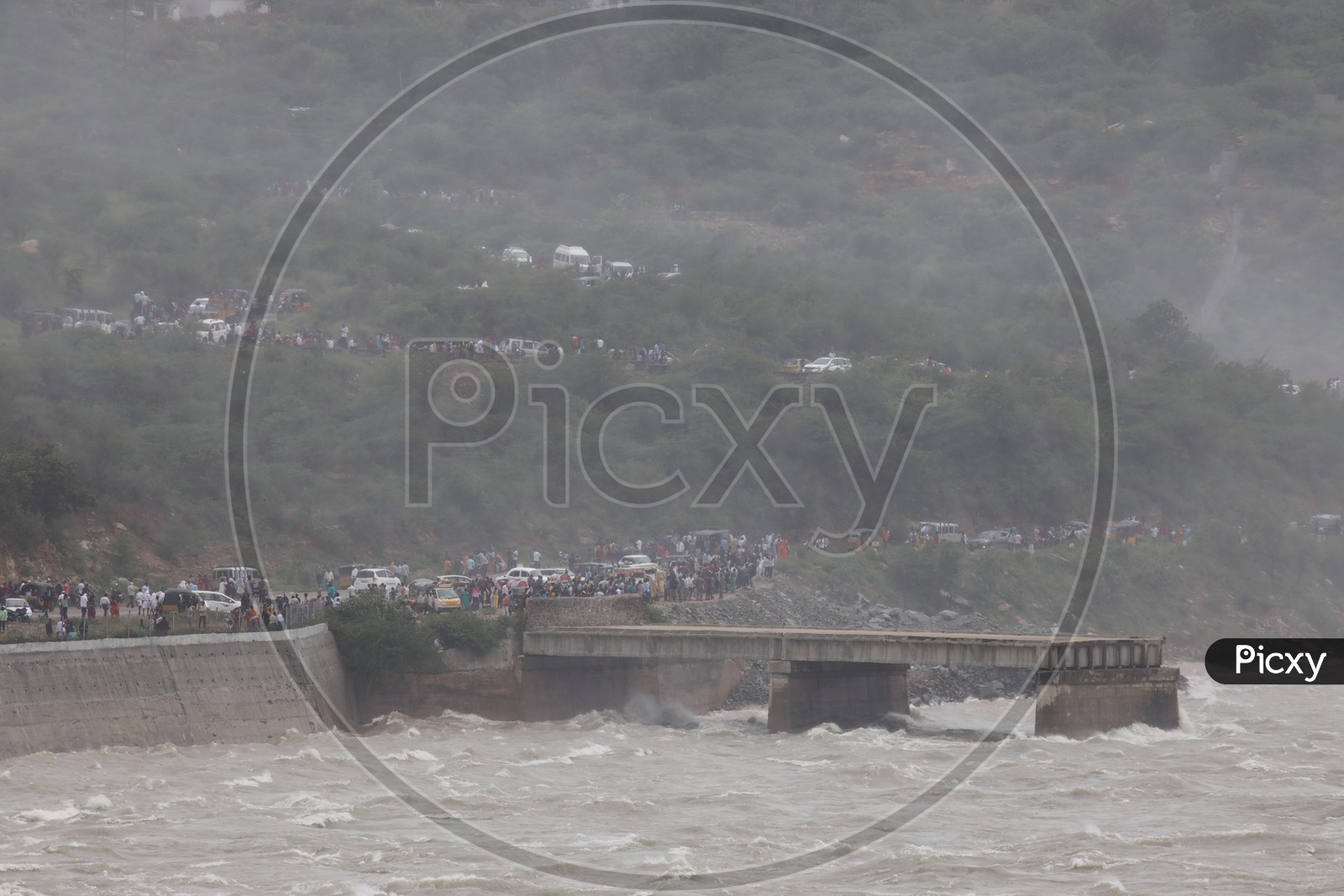 Water Flowing At Full strength And Visitors Witnessing The View  At Nagarjuna Sagar Dam
