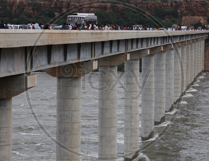 Water Flowing At Full Strength With Currents Due to Heavy Floods To Nagarjuna Sagar Dam  At The Bridge