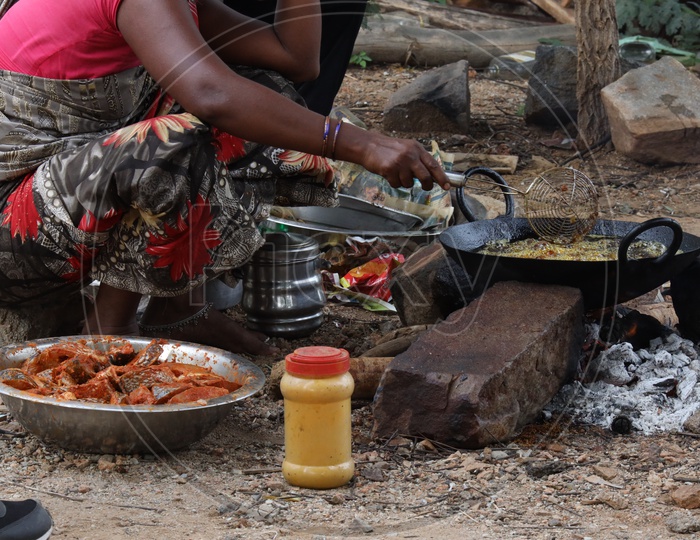 Street Food Vendor Preparing Fish Fry