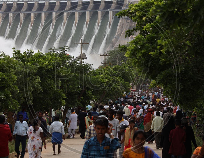Visitors Crowd At Nagarjuna Sagar Dam Gates Opened Water Gushing Heavily