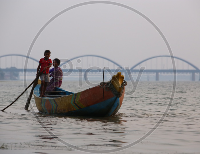 Fishing Boats On River Godavari With Arch Railway Bridge In Background
