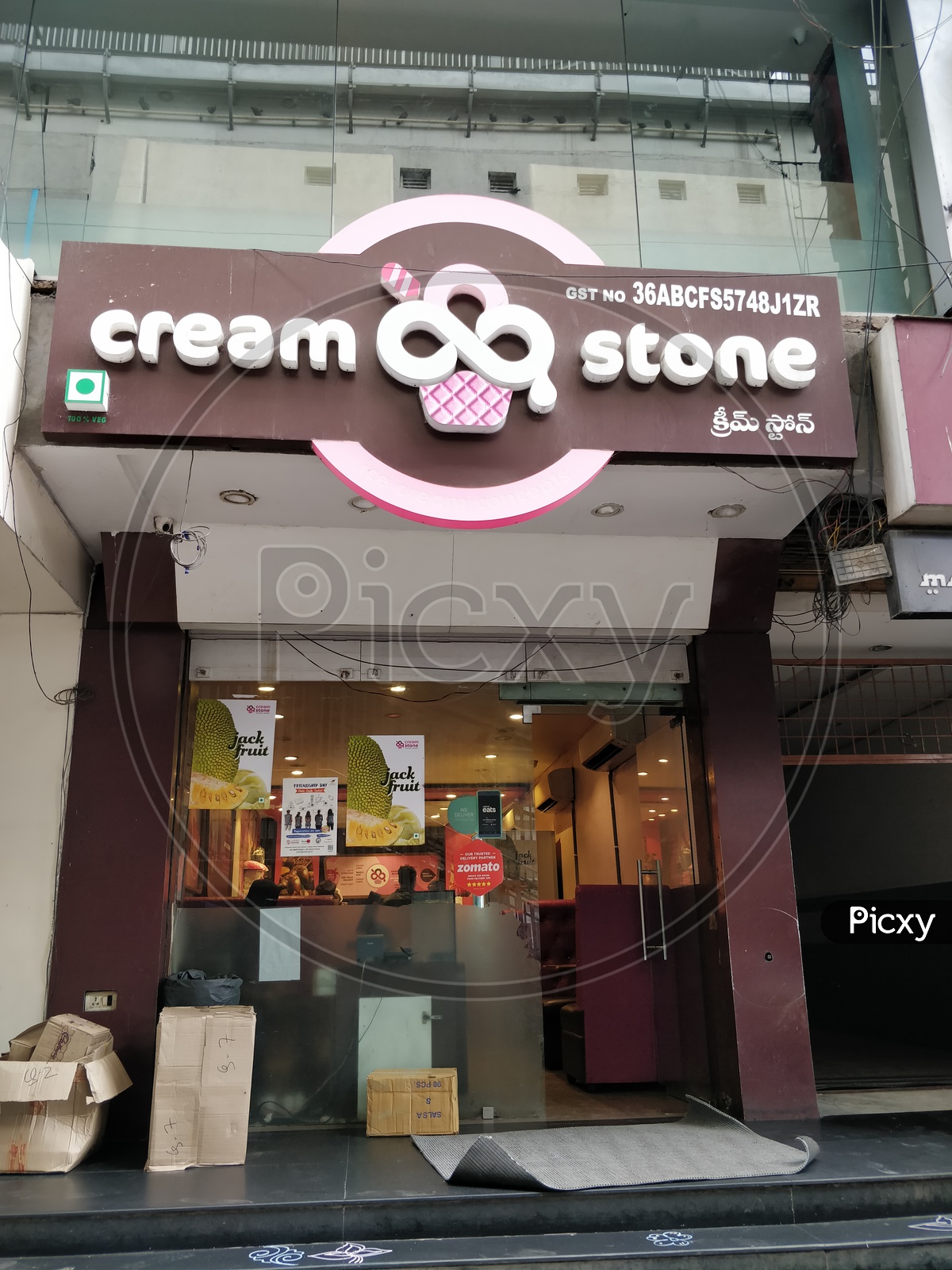 Cream stone store front with logo