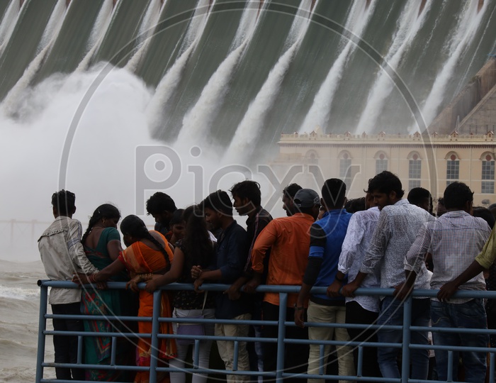 Visitors Watching The  Nagarjuna Sagar Dam Gates Opened Water Gushing Due To Heavy Floods