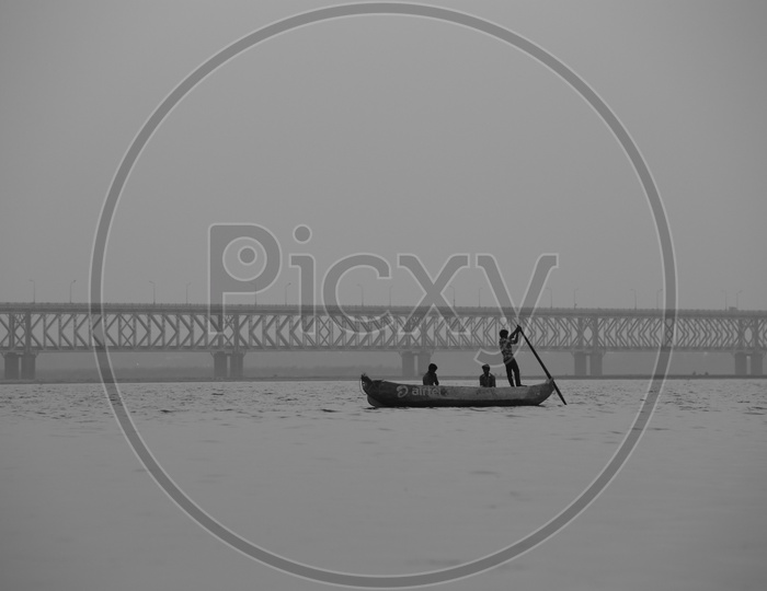 Fisher Boats on River Godavari With  Railway Cum Road Bridge In Background