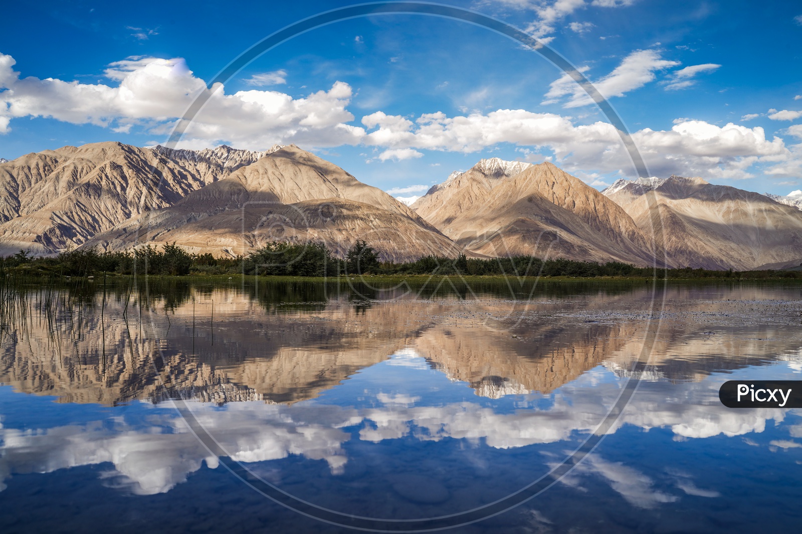 Reflection Of Mountains and Blue Sky On the River Water Surface