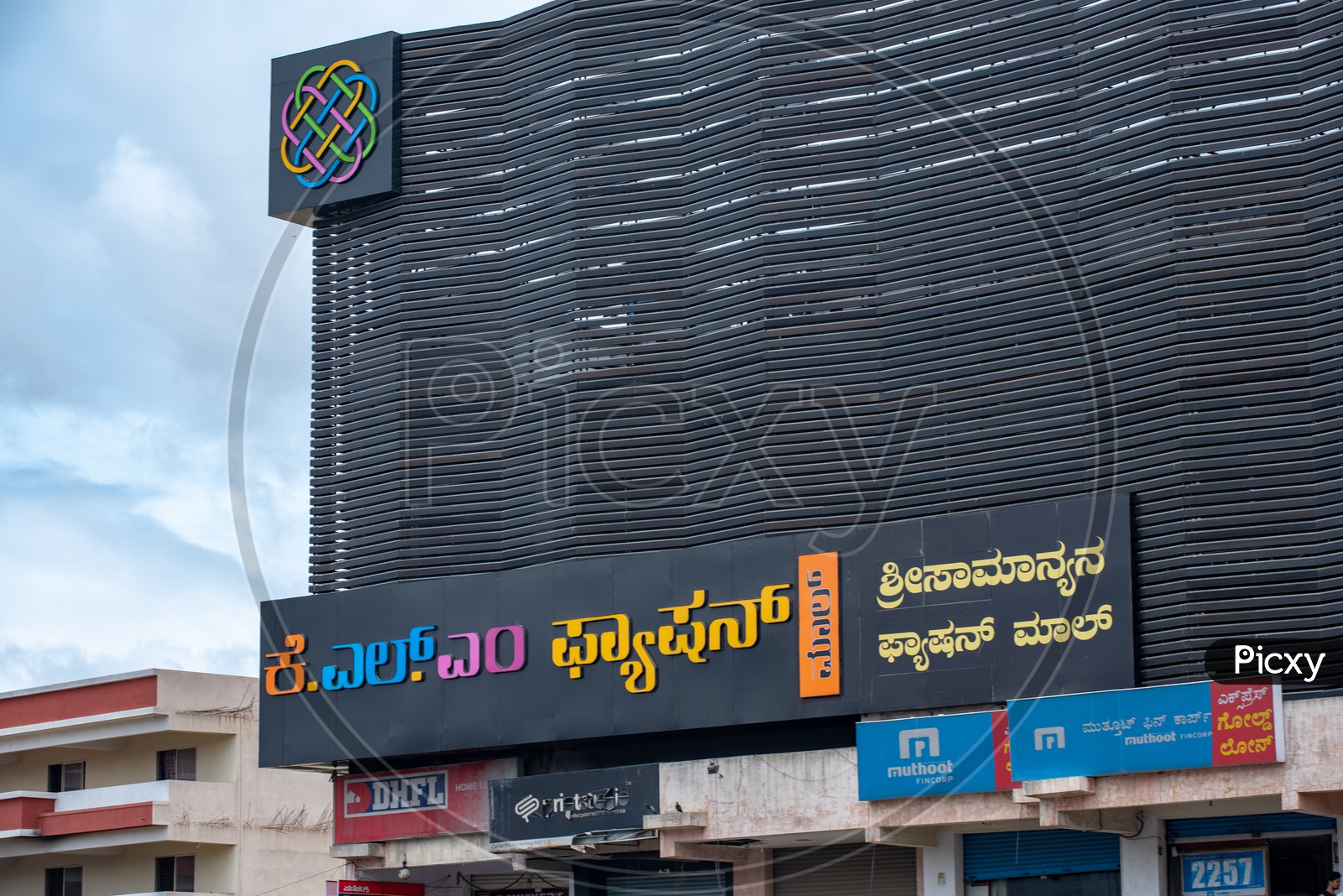 KLM FASHION mall name board on the store in Kannada