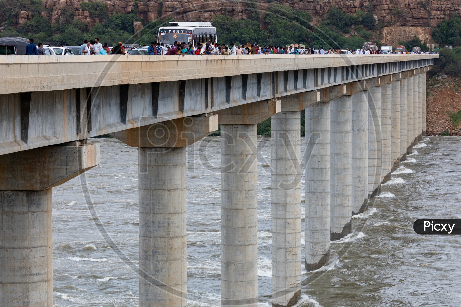Heavy traffic of commuting vehicles on the bridge near Nagarjuna Sagar Dam as the gates opened due to heavy flood to reservoir