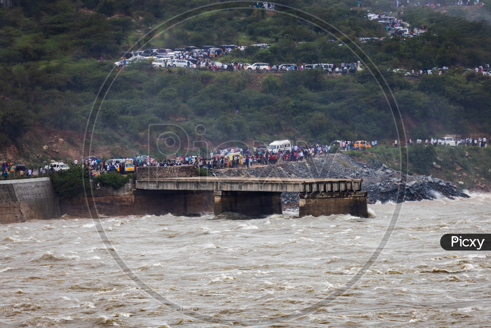 Visitors at Nagarjuna Sagar Dam as the gates opened water gushing