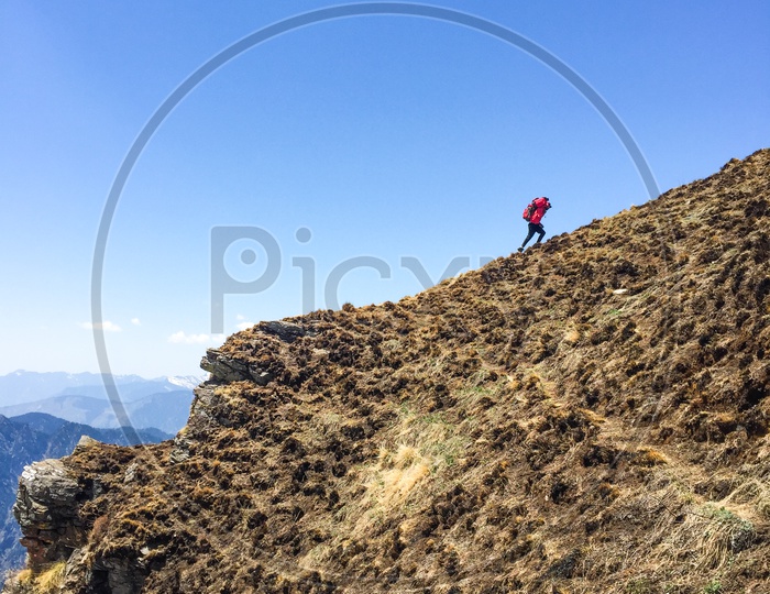 Trekker Adventurer With Backpack Climbing The Valleys in Rupin Pass Mountains