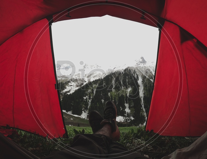 A View Of Snow Capped Mountains From a Tent House