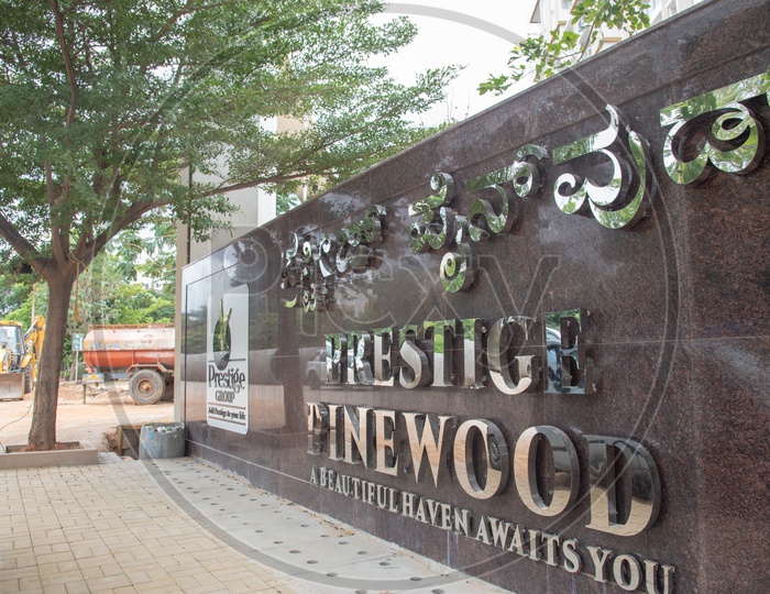 Prestige Pinewoods by Prestige Group Name board