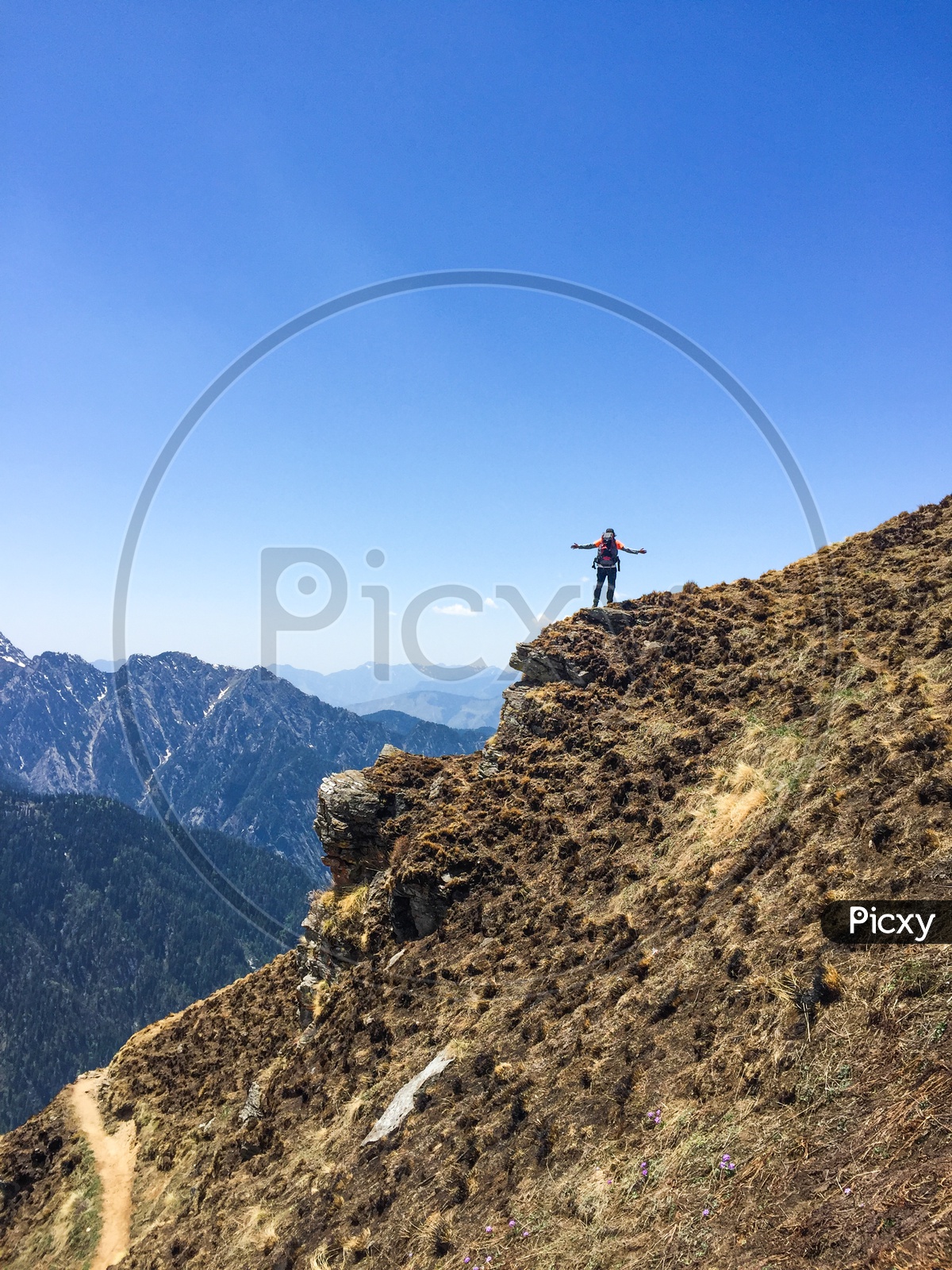 Trekker Adventurer With Backpack Climbing The Valleys in Rupin Pass Mountains