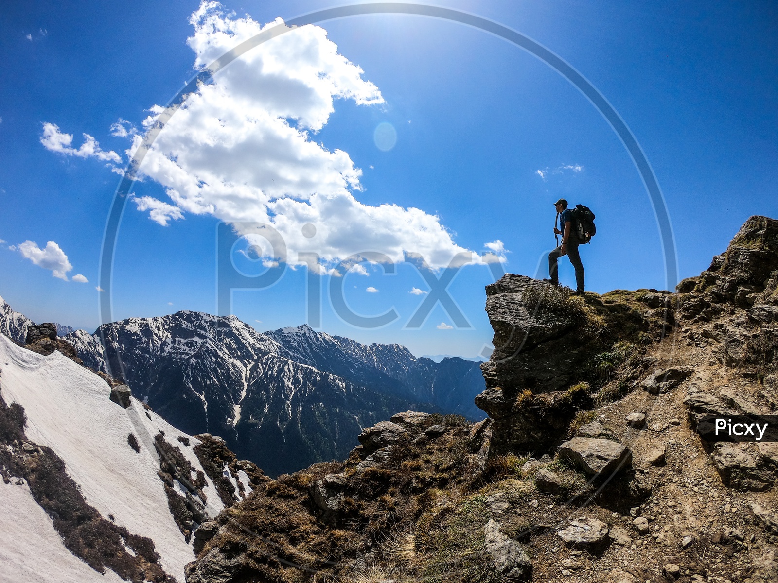 An Adventurer trekker With Backpack On mountains