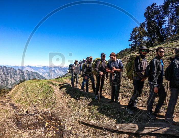 Trekkers Adventurers Climbing Snow Capped Mountains  In Rupin Pass