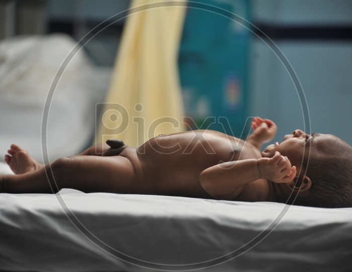 New Born Baby Boy On a Hospital Bed