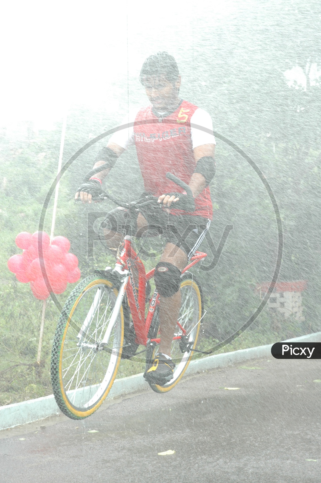 Road Bicycle Racing and Water Splashing on Cycle