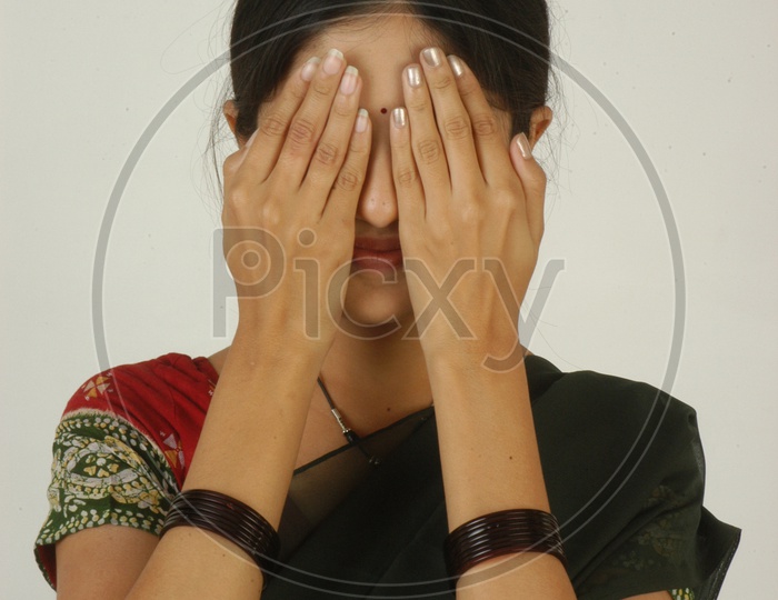 Young Woman closed eyes with hands