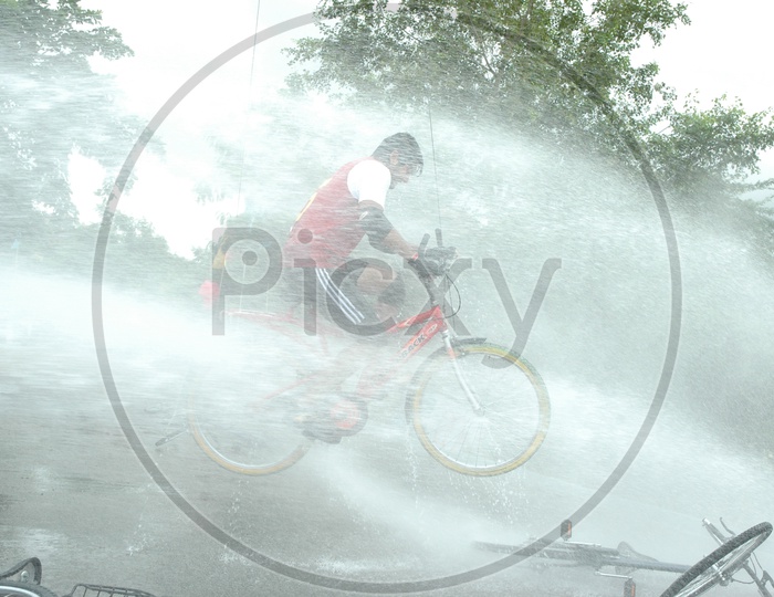 Road Bicycle Racing and Water Splashing on Cycle