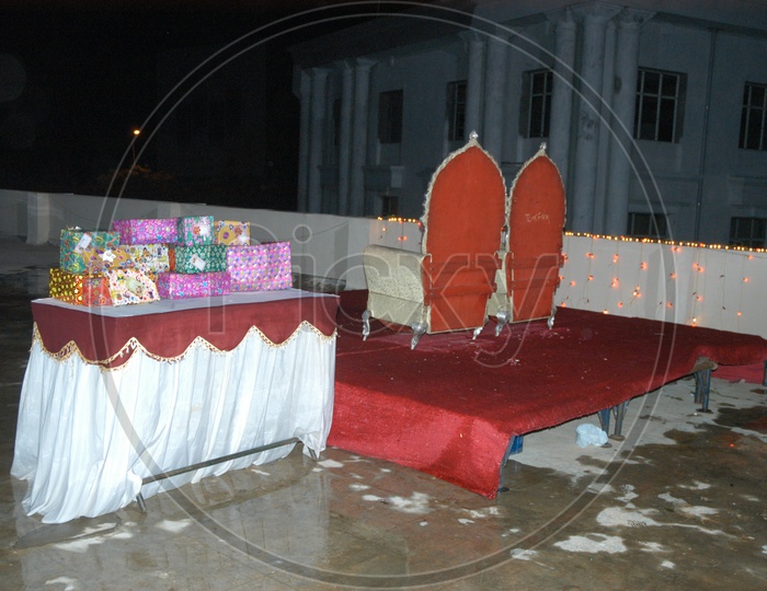 Gifts And Dias With King Size Chairs in a Function
