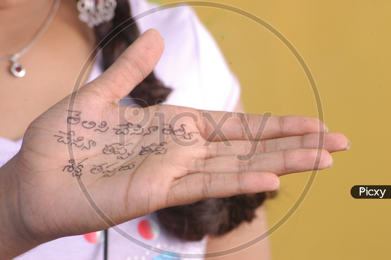 Telugu Words written on a Woman Hand