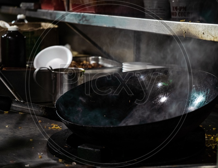 Empty wok with smoke