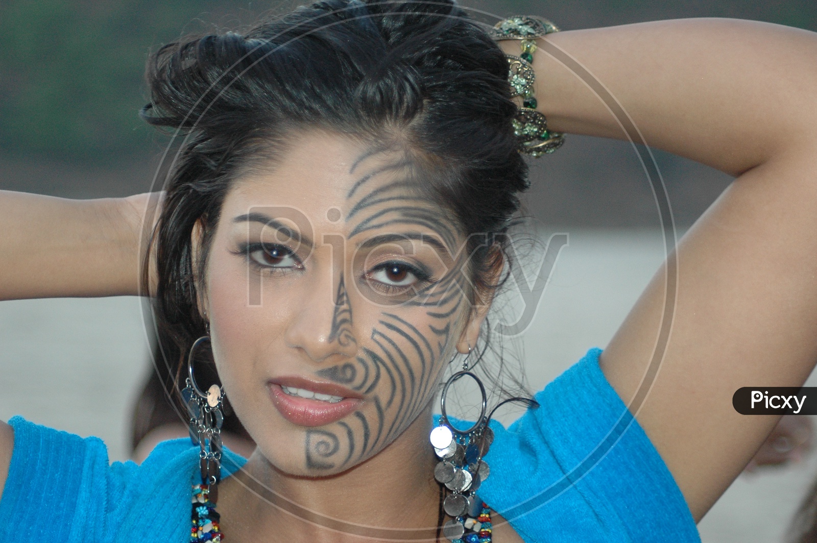 Young Indian Woman with Painting on her Face