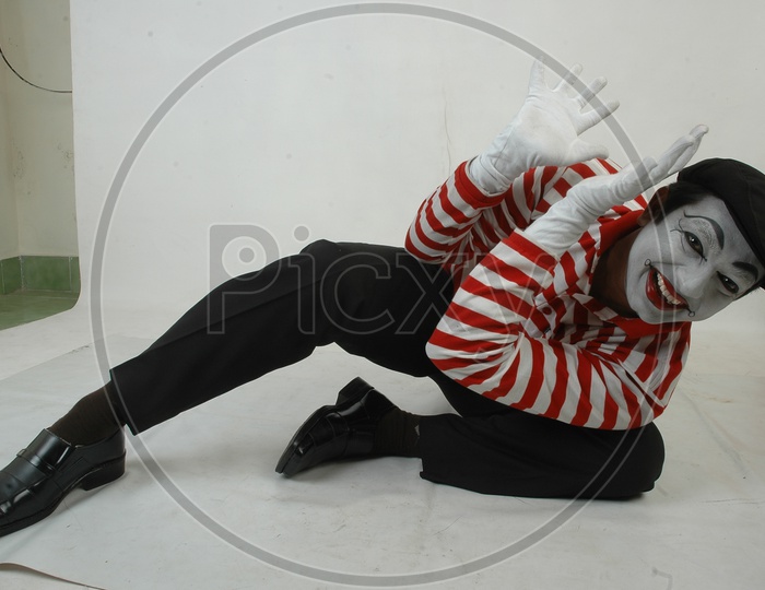 Male Mime Artist With Gestures Isolated over White Background