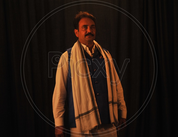 Indian Man As Politician Posing For a Photo In a Studio Setup