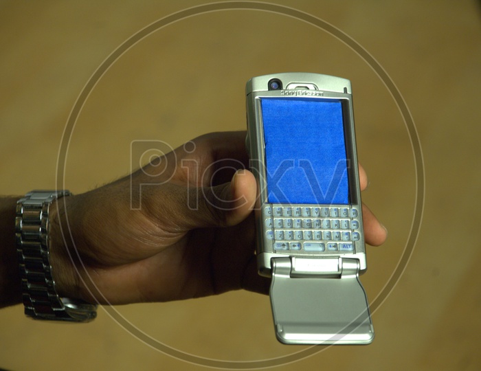 Indian Man Showing Mobile or Smartphone