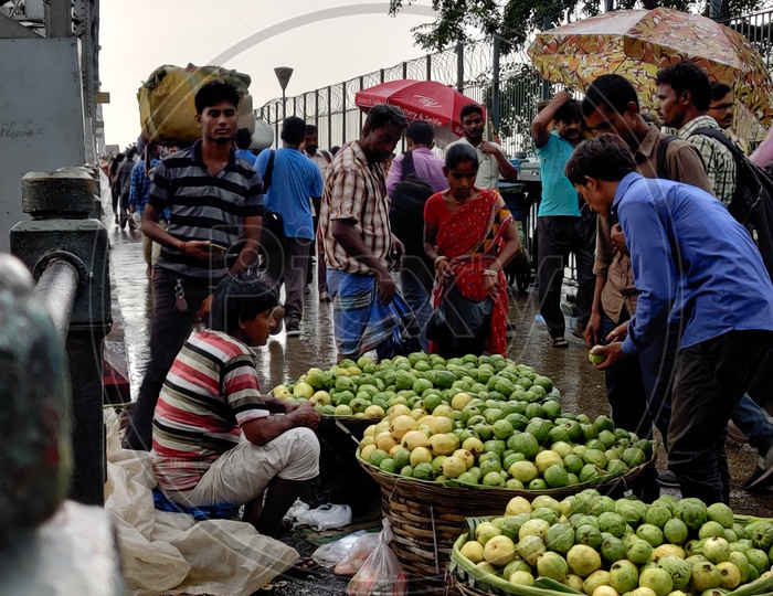 Guava seller on a rainy day -Howrah Bridge