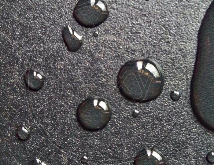 Water Droplets Ob a Black Surface