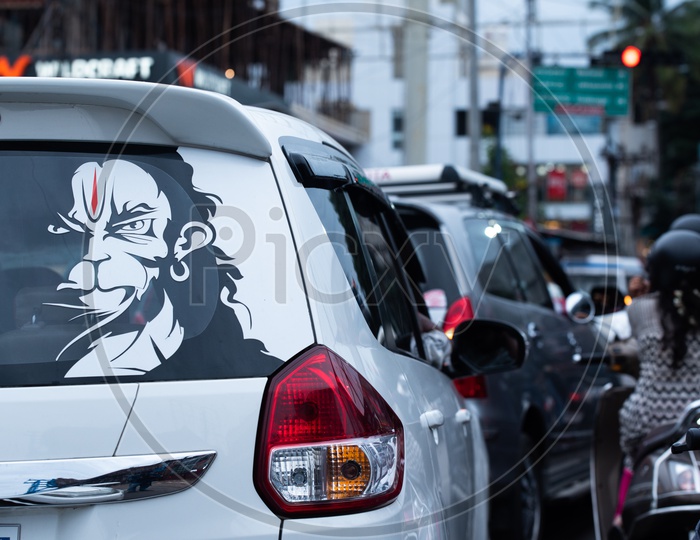 Angry Hanuman Poster on the back of a Car