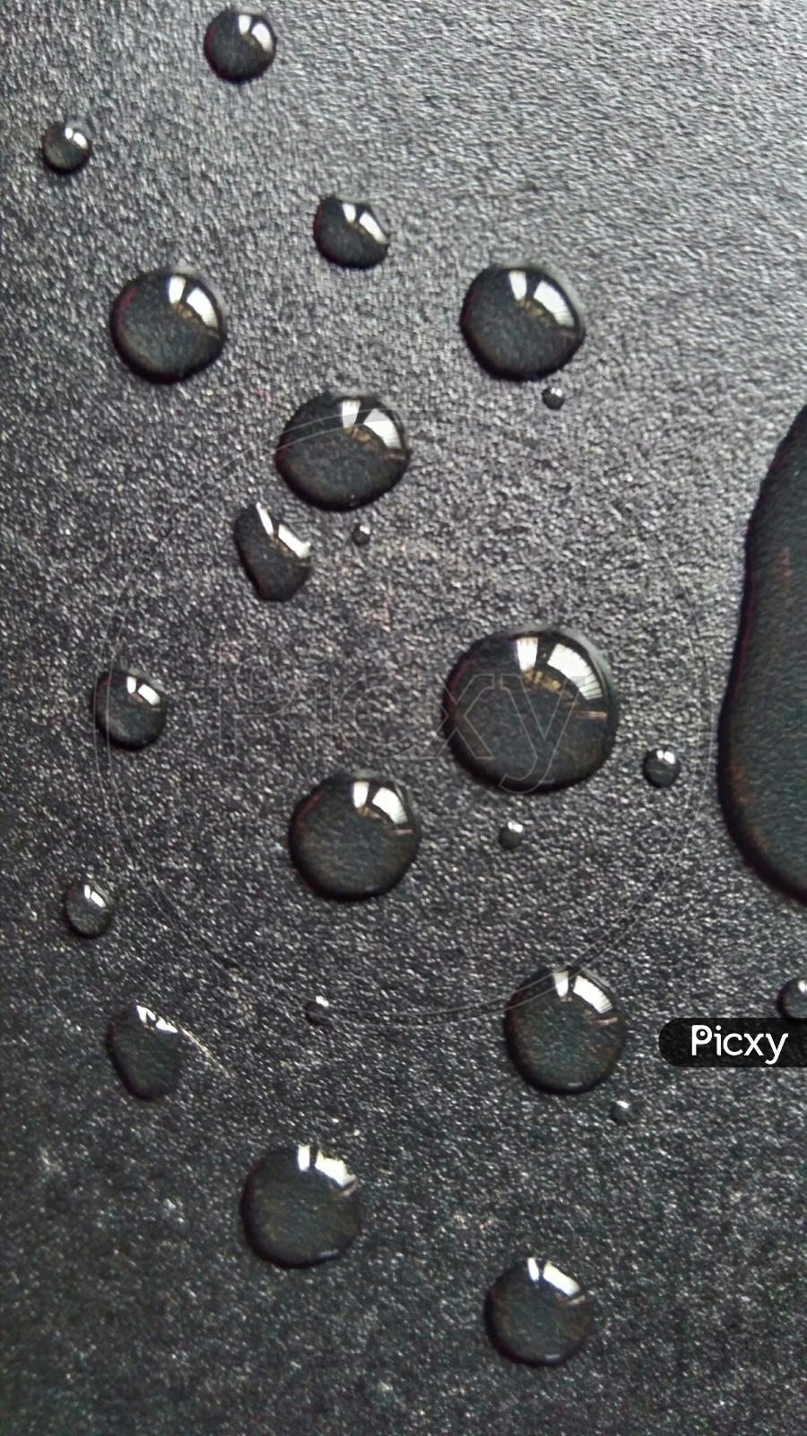 Water Droplets Ob a Black Surface