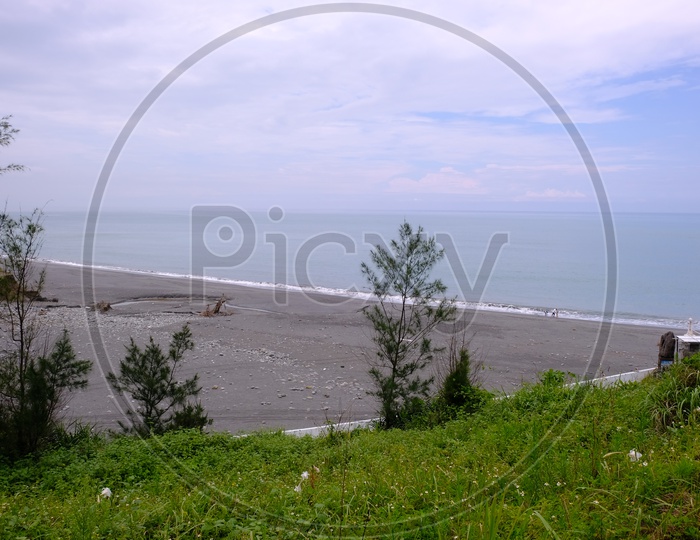 View of Dulan Beach with Clouds in Sky Background