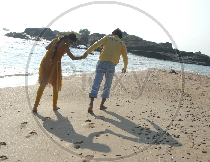 Young Indian Couple walking near Beach