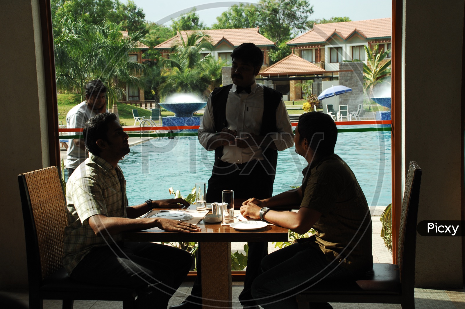 Friends in a Restaurant giving order to waiter